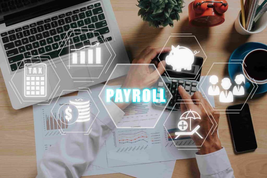 A person working on payroll calculations using a laptop and calculator, with digital icons representing tax, salary, employee management, and financial analytics.
