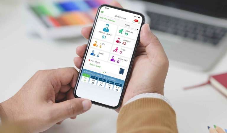 Mobile attendance software dashboard displaying employee statistics, attendance tracking, and real-time workforce management data on smartphone screen