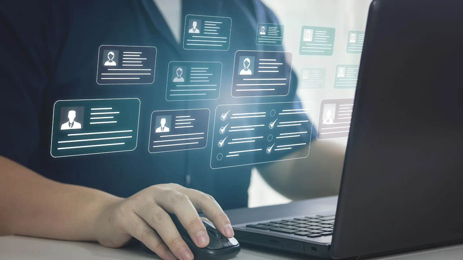 Person using HRM software on a laptop to manage digital employee profiles and tasks, representing the best HRM solution in Pakistan for growing businesses.