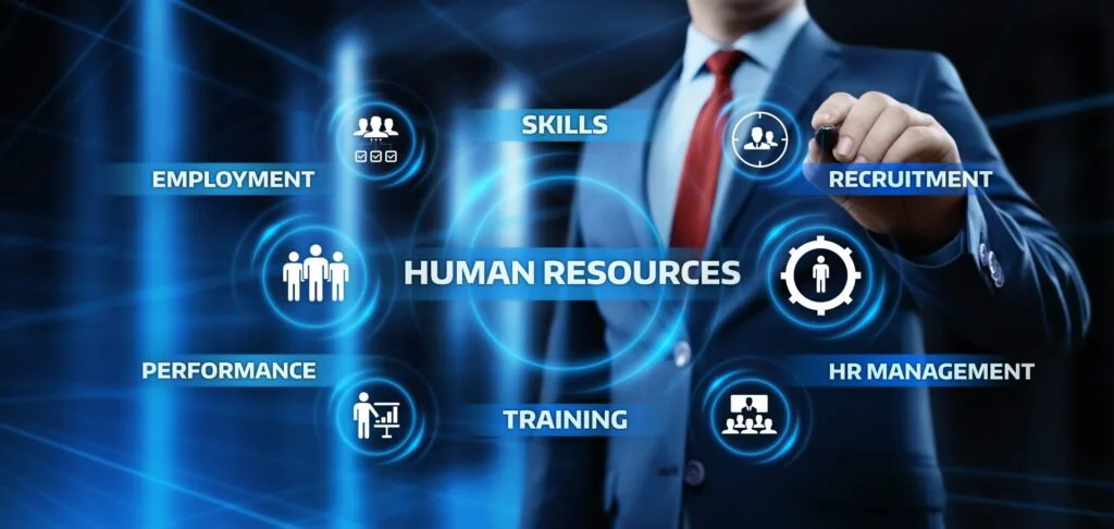 A professional in a suit interacting with a virtual interface featuring icons and terms related to human resources, such as skills, recruitment, training, employment, HR management, and performance. Human Resource Services Companies in Pakistan: Top 5 Providers