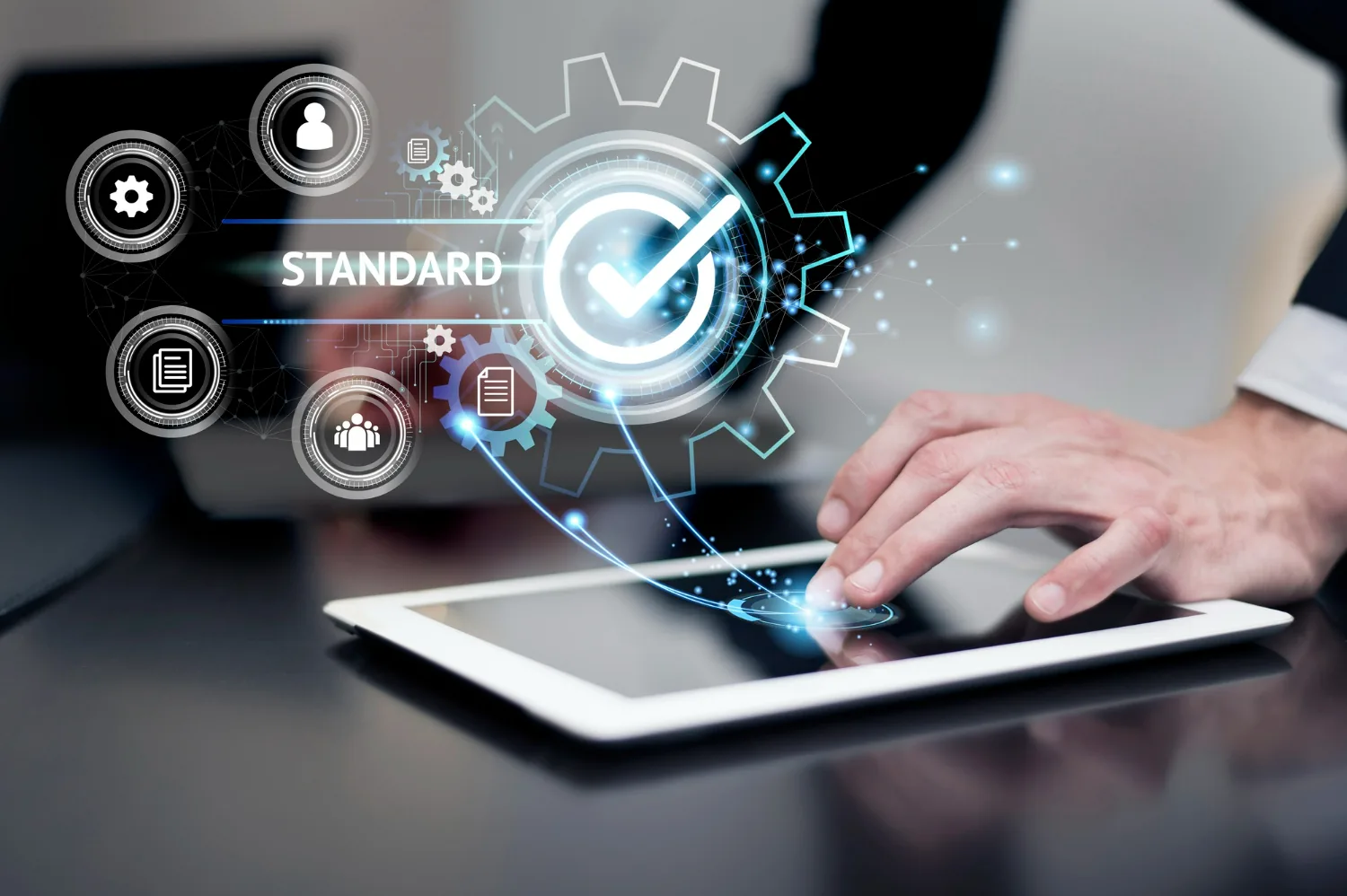 Business professional using digital HR interface on tablet with automation icons and "Standard" displayed – representing the best HRSM in UAE.